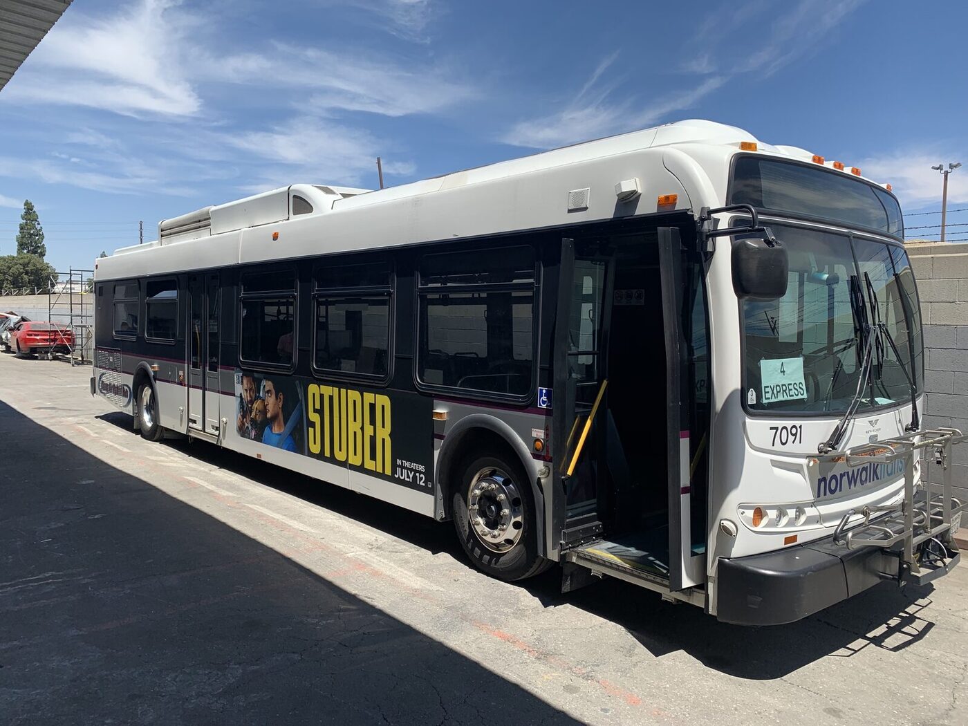 Norwalk Transit New Flyer 7091 in the old white livery with an ad wrap, before repaint