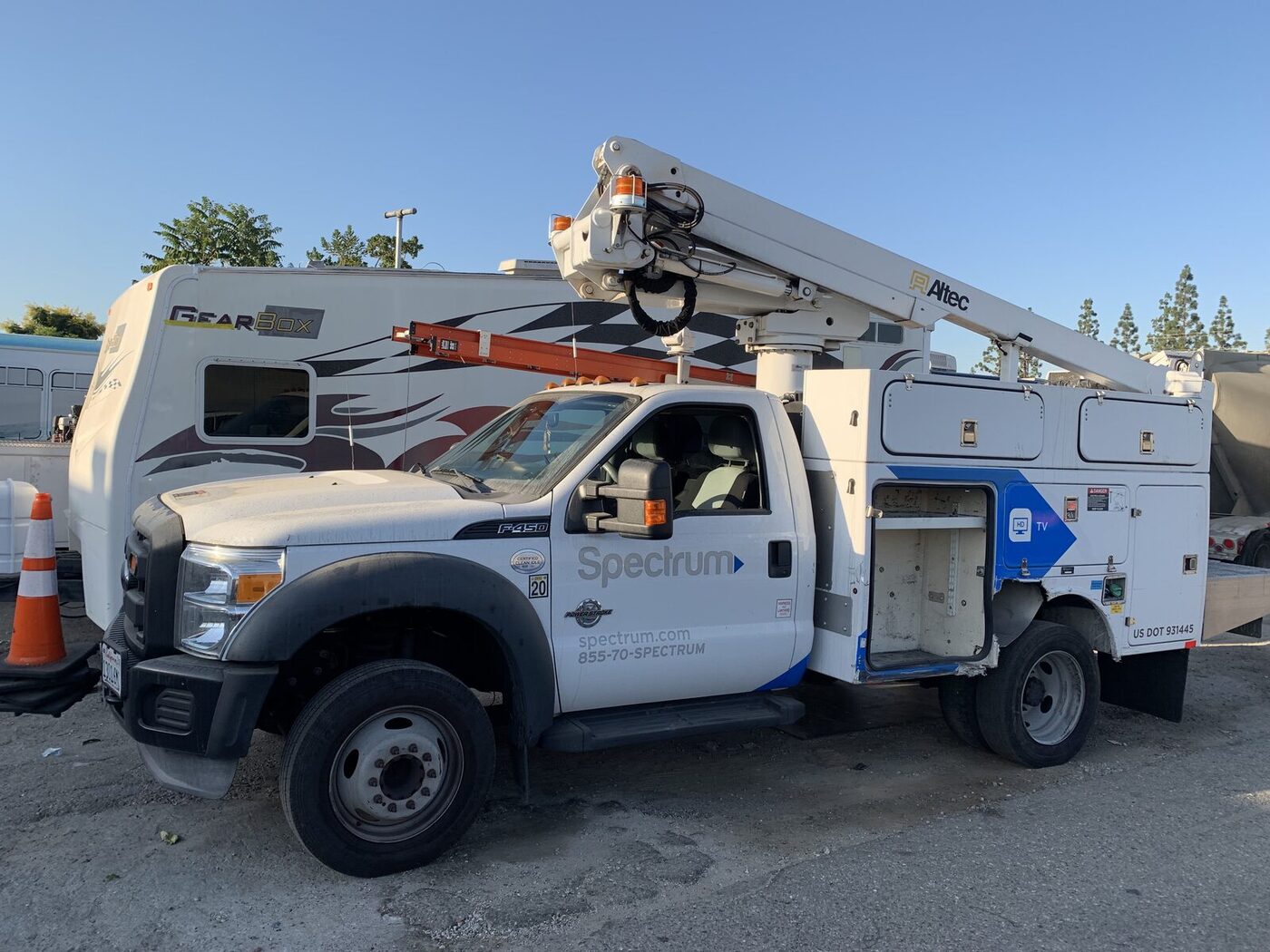 Spectrum F-450 bucket truck with damaged utility body compartment before repair
