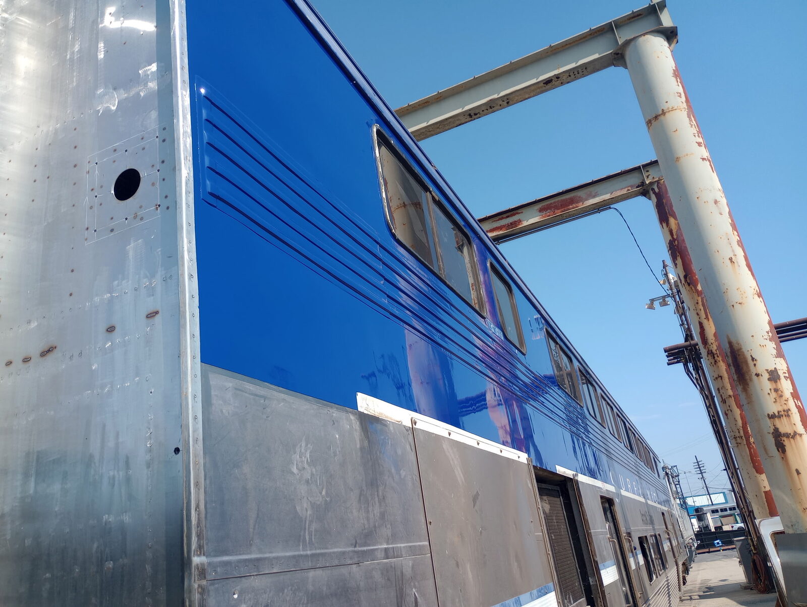 Rail cab car with new blue finish over aluminum body
