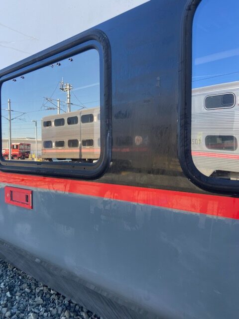 Caltrain window and red stripe detail